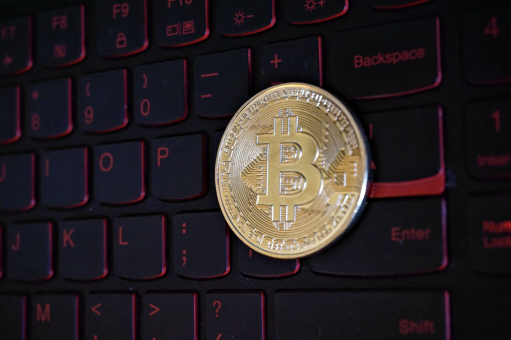 Bitcoin Token on Backlit Computer Keyboard Ⓒ 2023 – Crypto Coin Opps