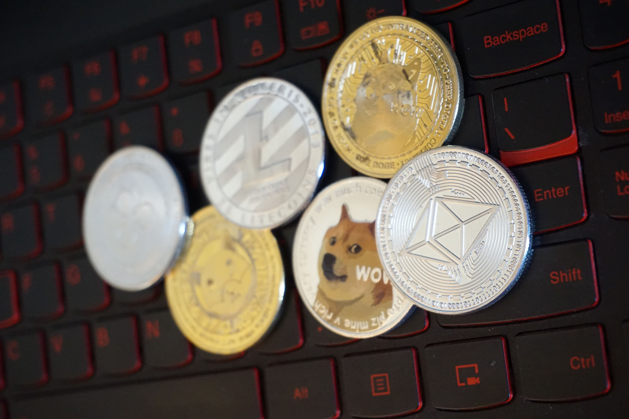 Cryptocoins on a Lenovo laptop keyboardⒸ 2023 – Crypto Coin Opps