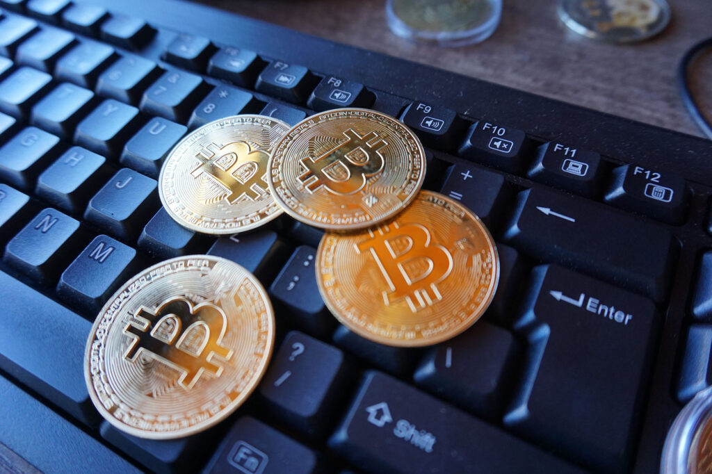 Gold Bitcoin [$BTC] Tokens On Black Computer Keyboard Ⓒ 2023 – Crypto Coin Opps