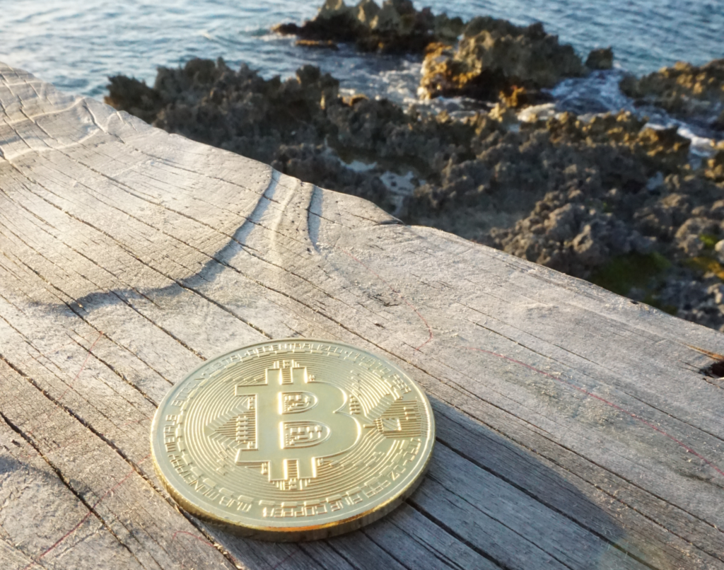 Looking at a Bitcoin token at Upward Angle Ⓒ 2023 – Crypto Coin Opps