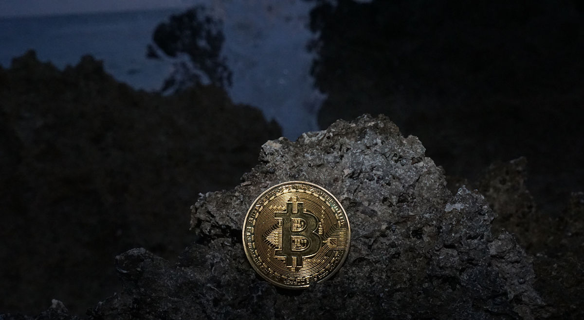 Real Bitcoin (BTC) In Front of Crashing Ocean WaveⒸ 2023 – Crypto Coin Opps