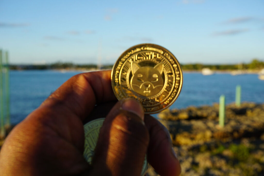 Shiba Inu ($SHIB) Coin Held In Front of Bayahíbe-Dominican Republic Coastline Ⓒ 2023 – Crypto Coin Opps