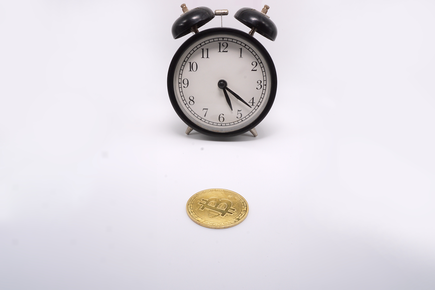 Bitcoin ($BTC) in Front of Alarm Clock Ⓒ 2023 – Crypto Coin Opps