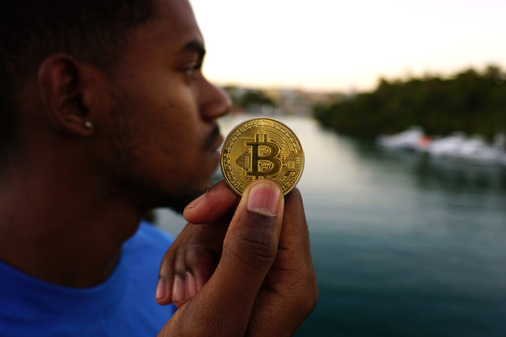 Man pondering the future of Bitcoin cryptocurrency Ⓒ 2023 – Crypto Coin Opps