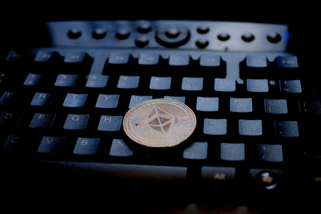 Physical Ethereum Coin On Kensington Computer Keyboard Ⓒ 2023 – Crypto Coin Opps