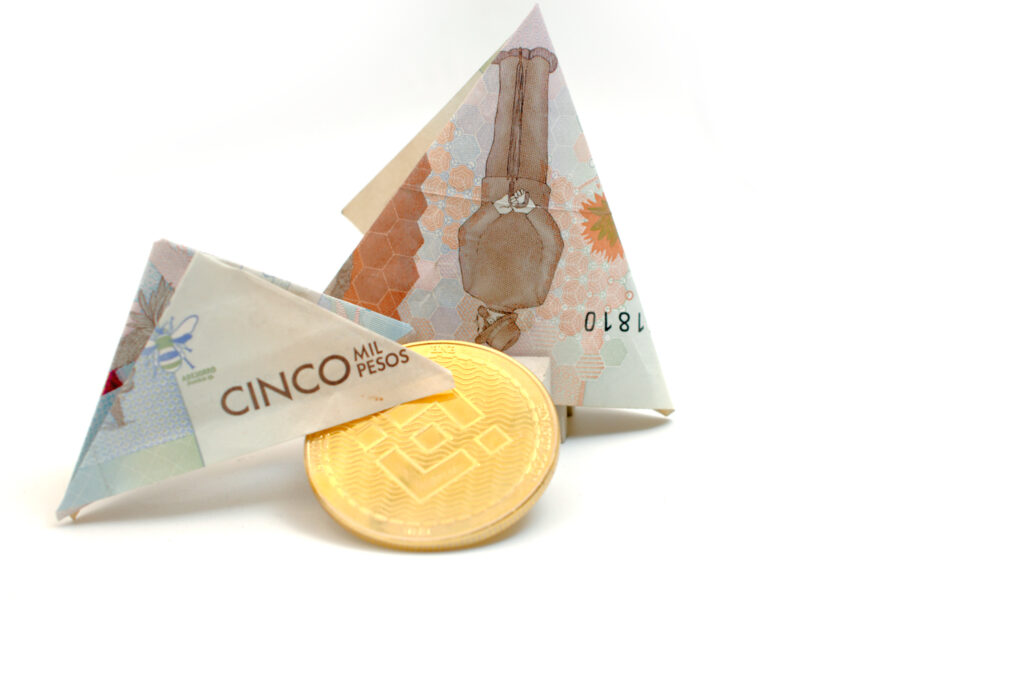 Binance [$BNB] Coin With Folded Colombian Pesos Ⓒ 2023 – Crypto Coin Opps
